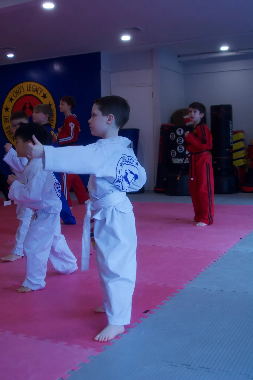 Group of students with belts and trophies